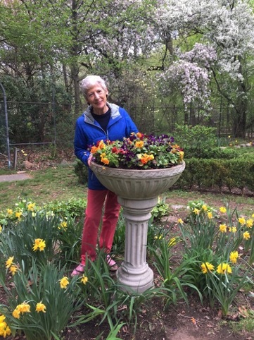 Marie Claire Kamin, just after she finished planing the urn with spring flowers.