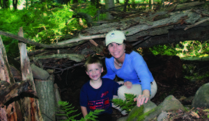 Priscilla Geigis and her nephew Grant pictured in front of their tree fort.